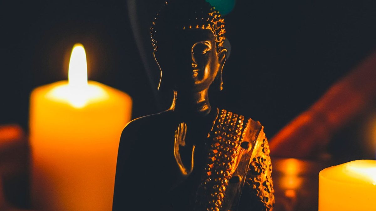 Candlelight Buddha in a room